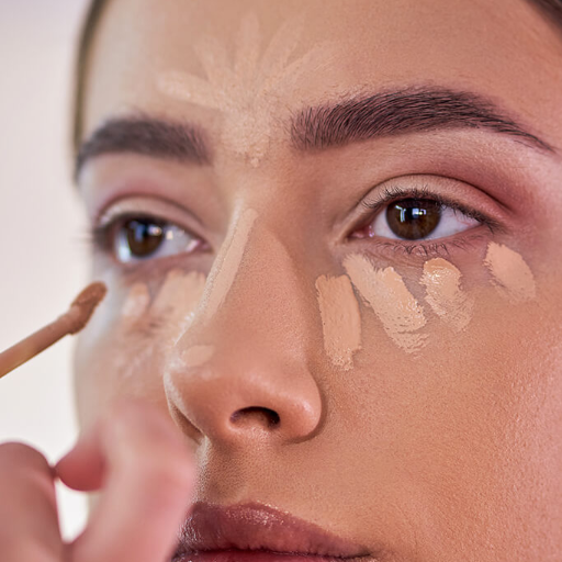 How can you apply under-eye concealer for a flawless finish