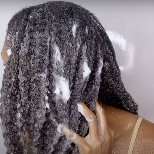 What are the best techniques for applying shampoo to curly hair