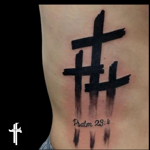 What is the significance of a three-cross tattoo design_